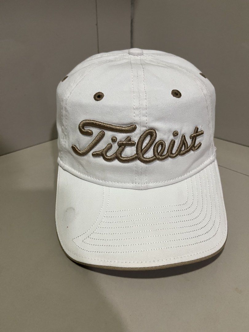 Titleist Golf Cap White Brown (Category: Caps & Hats) located in Maasin. Submitted by niconii090 (Listing ID 1468984938, Image 1). Description: - Authentic Titleist golf cap in clean white with brown accents - Classic unstructured dad hat design for a relaxed fit - Features eye-catching brown embroidered branding on the front - Contrasting brown eyelets and brim edge detailing - Adjustable strapback closure with a durable metal buckle - Finished 