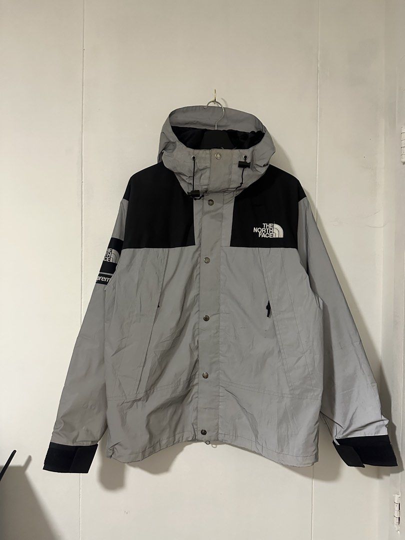 TNF x Supreme Reflectorized (Category: Coats, Jackets and Outerwear) located in Las Pinas. Submitted by archimedes.joaquin (Listing ID 1469032299, Image 2). Description: - Excellent condition - 9/10 color rate - sz L on tag ( 24” w / 28” L ) Issue: yung snap button sa pinaka baba ayaw na mabuksan/ may stain sa leeg na part ( 9th picture ).