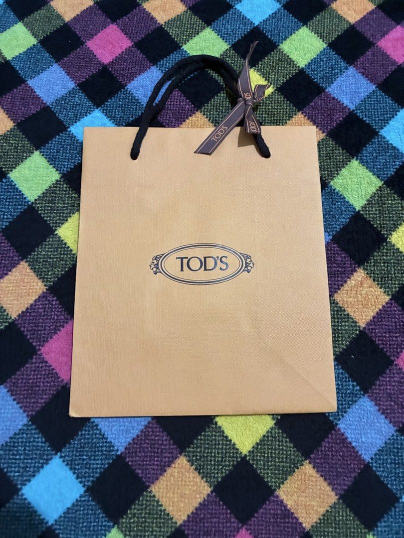 TODS gift bag supplies (Category: Everything Else Others) located in Muntinlupa City. Submitted by mystyle10 (Listing ID 1469006854, Image 1). Description: New for gift supplies; paper bag with TODS ribbon.