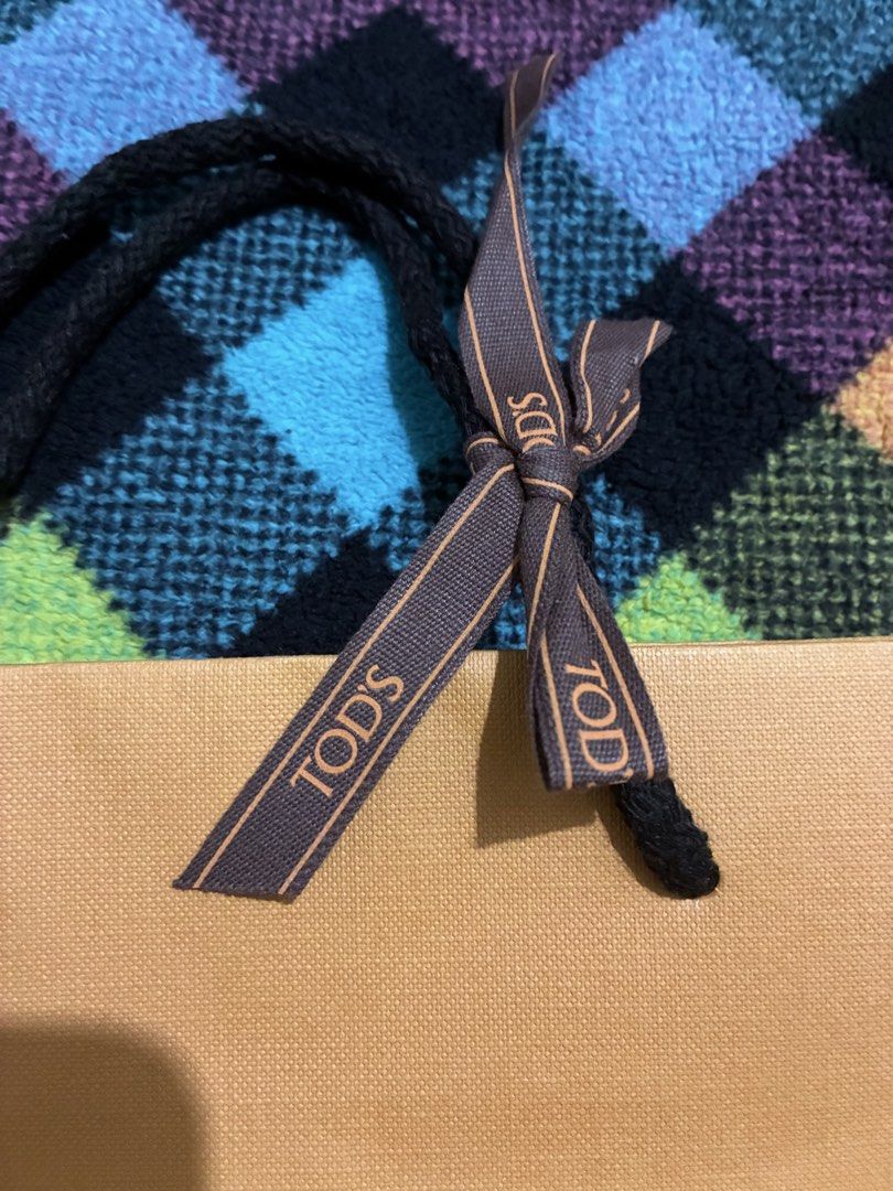 TODS gift bag supplies (Category: Everything Else Others) located in Muntinlupa City. Submitted by mystyle10 (Listing ID 1469006854, Image 2). Description: New for gift supplies; paper bag with TODS ribbon.