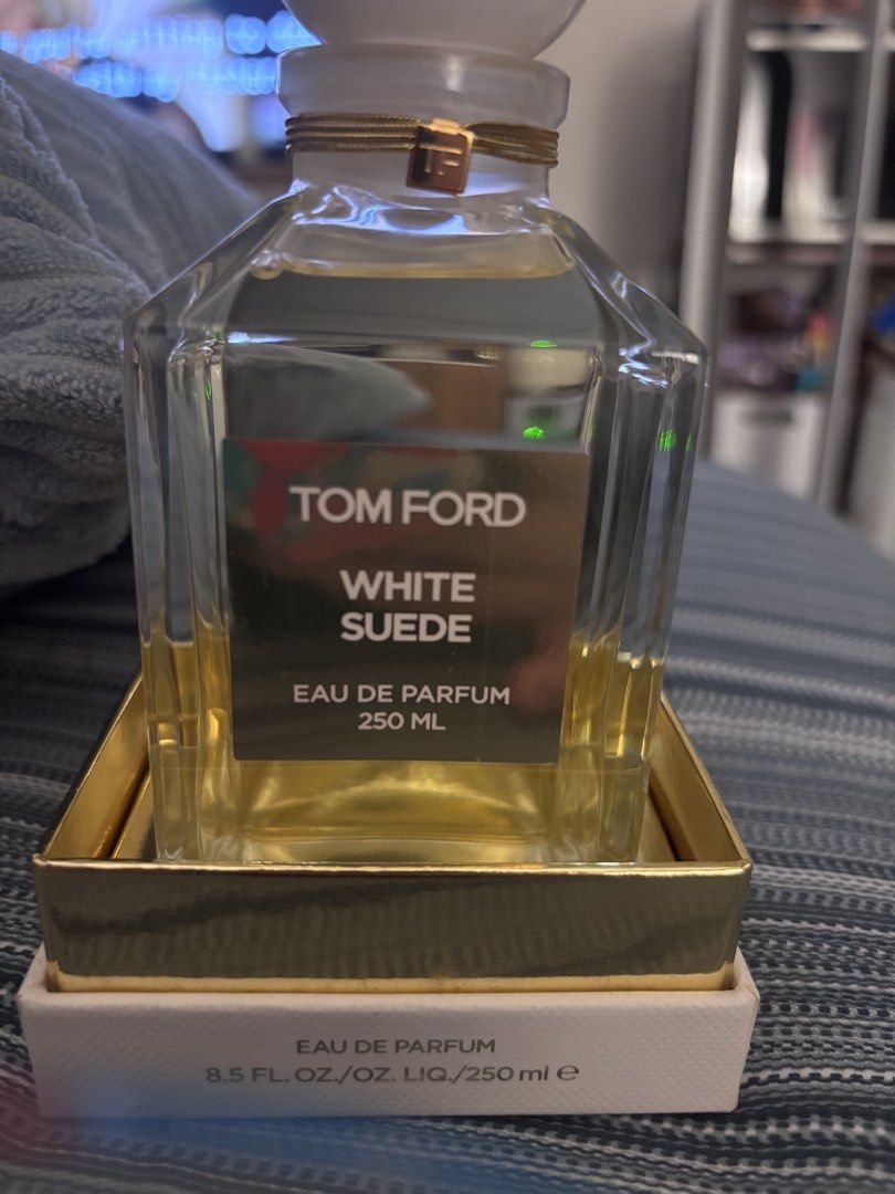 Tom Ford White Suede Eau De Parfum 250ml (Category: Fragrance & Deodorants) located in Paranaque City. Submitted by kikayjen (Listing ID 1469100310, Image 3). Description: - Authentic Tom Ford White Suede Eau de Parfum - Massive 250ml decant flacon with iconic gold label - Includes original white and gold outer box - Features signature round white cap with TF logo charm - 100% authentic, well-stored - This retails to 40k in dept stores and TF sta