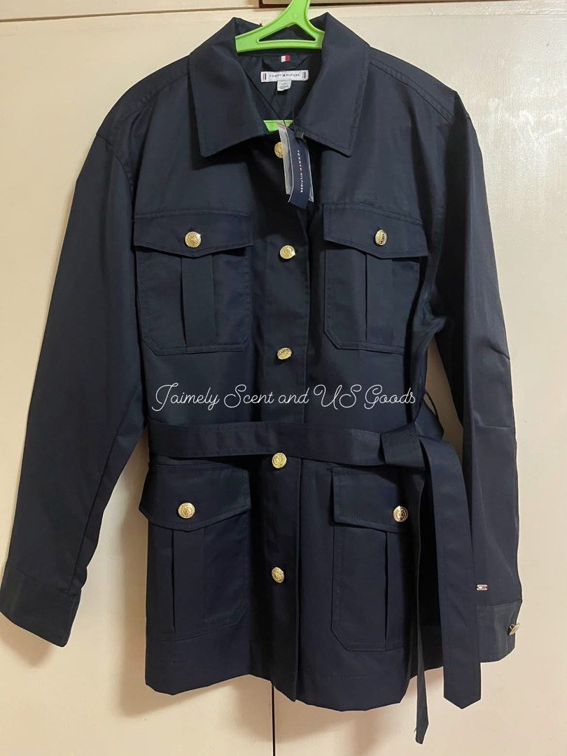 TOMMY HILFIGER GOLD BUTTON BELTED UTILITY JACKET NAVY BLUE LARGE (Category: Coats, Jackets and Outerwear) located in Las Pinas. Submitted by jaimelyscent_ (Listing ID 1469034246, Image 1). Description: TOMMY HILFIGER BELTED UTILITY JACKET FOR WOMEN LARGE NAVY BLUE ✅NEW ARRIVAL FROM USA🇺🇸$179 MALL PRICE NOW ON CLEARANCE SALE 📌2999.00 ONLY GRAB IT NOW.