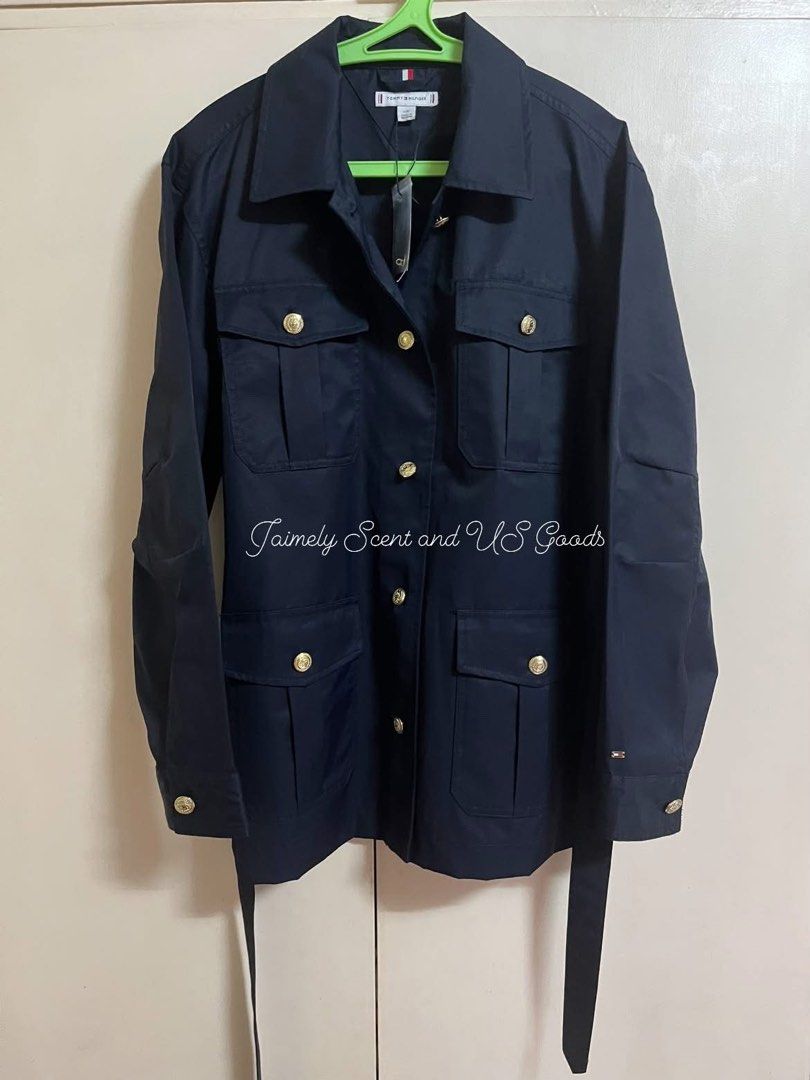 TOMMY HILFIGER GOLD BUTTON BELTED UTILITY JACKET NAVY BLUE LARGE (Category: Coats, Jackets and Outerwear) located in Las Pinas. Submitted by jaimelyscent_ (Listing ID 1469034246, Image 2). Description: TOMMY HILFIGER BELTED UTILITY JACKET FOR WOMEN LARGE NAVY BLUE ✅NEW ARRIVAL FROM USA🇺🇸$179 MALL PRICE NOW ON CLEARANCE SALE 📌2999.00 ONLY GRAB IT NOW.
