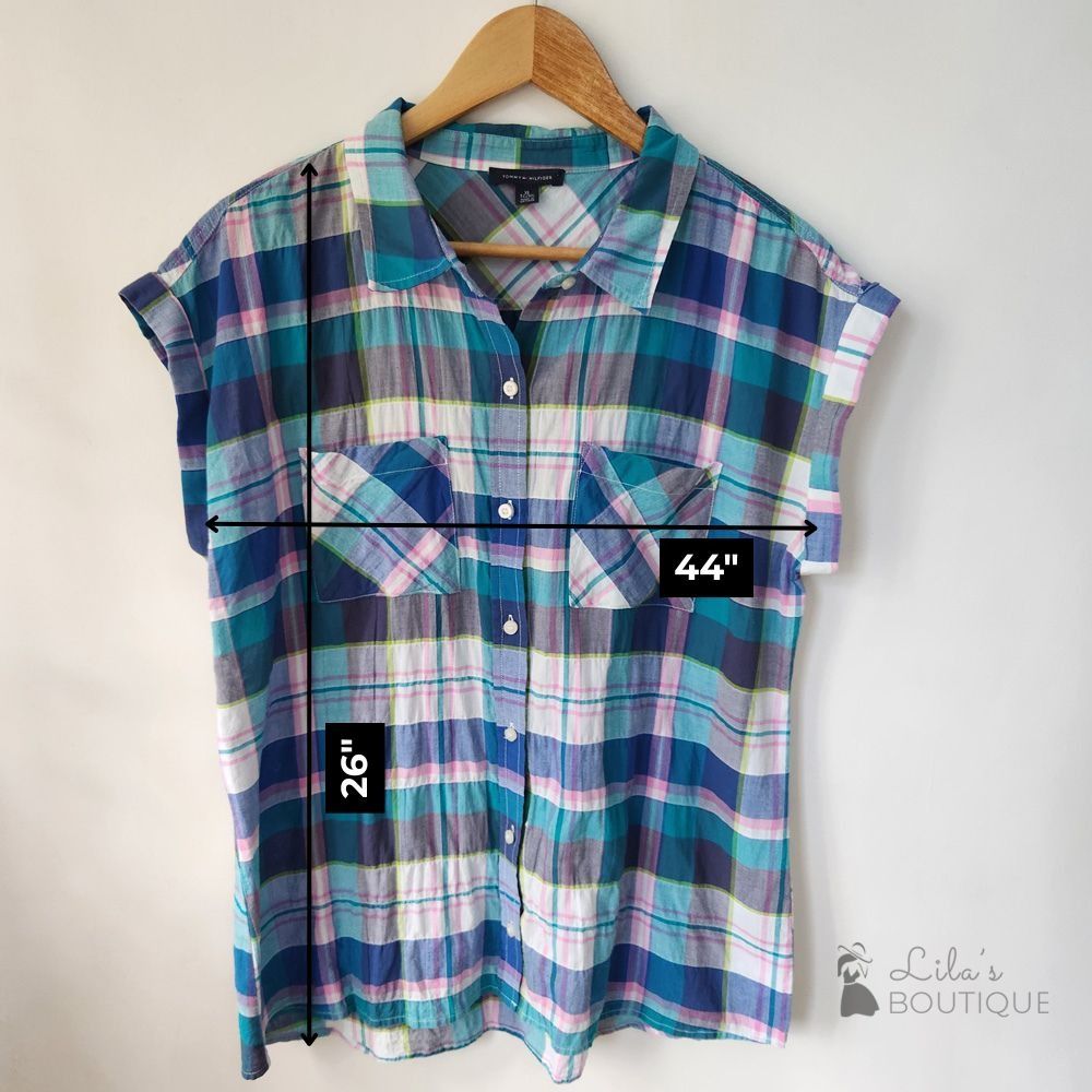 Tommy Hilfiger Plaid Short Sleeve Button Up Top (Category: Blouses) located in San Fernando. Submitted by lilasboutique (Listing ID 1468934537, Image 2). Description: Size: X-LARGE (XL) Chest: 44 in | Length: 26 in Fit: Regular Details: • Great Condition. No issues • Brand: Tommy Hilfiger • Color: Teal, Blue, White, Pink, Grey.