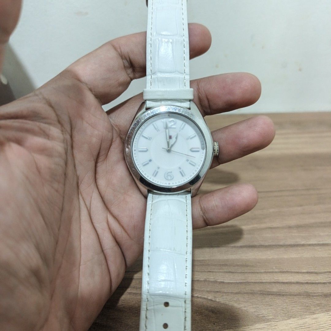 Tommy Hilfiger White Leather Strap Analog Watch (Category: Women's Watches) located in Manila. Submitted by narju1234 (Listing ID 1468998649, Image 2). Description: - Brand: Tommy Hilfiger - Model: TH.217.3.14.1468 - Dial: White dial with numbers at 12 and 6 - Strap: Genuine Italian white leather with crocodile pattern texture and standard buckle closure - Hardware: Silver-tone case and buckle with stainless steel back - Water Resistance: 30m - C