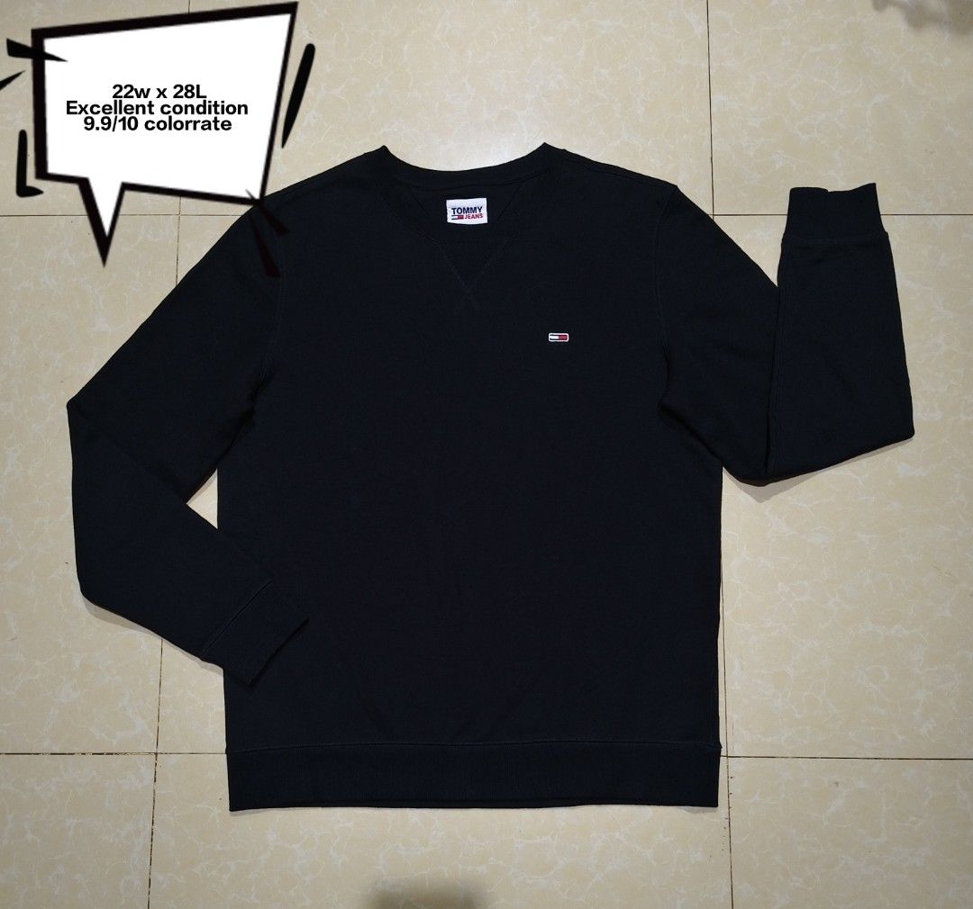 Tommy Jeans Black Sweatshirt Size XL (Category: Coats, Jackets and Outerwear) located in Manila. Submitted by purefire-477a (Listing ID 1469078127, Image 1). Description: - Brand: Tommy Jeans - Color: Black - Size: XL - Material: Cotton-polyester blend - Design: Crew neck with V-stitch detail and small chest logo embroidery - Fit: Classic fit with ribbed cuffs and hem - Measurements: Width 22" x Length 28" - Origin: Made in China.