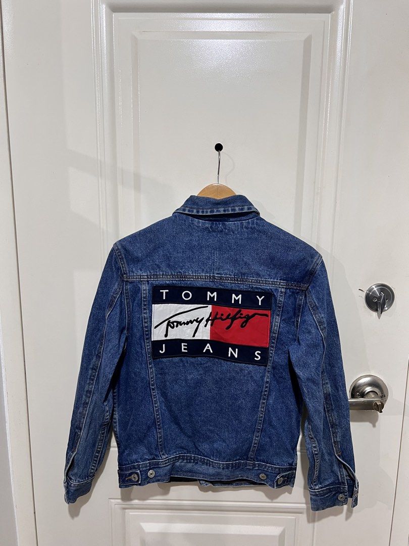 Tommy Jeans Denim Jacket with Back Logo (Category: Coats, Jackets and Outerwear) located in San Pedro. Submitted by _eyamarie (Listing ID 1469136720, Image 2). Description: Tommy Hilfiger Jeans Denim Jacket Excellent condition Color tate 9.5/10 No issue Need wash only Size XS ontag Width 19.5 Length 24 • 1,500+sf.