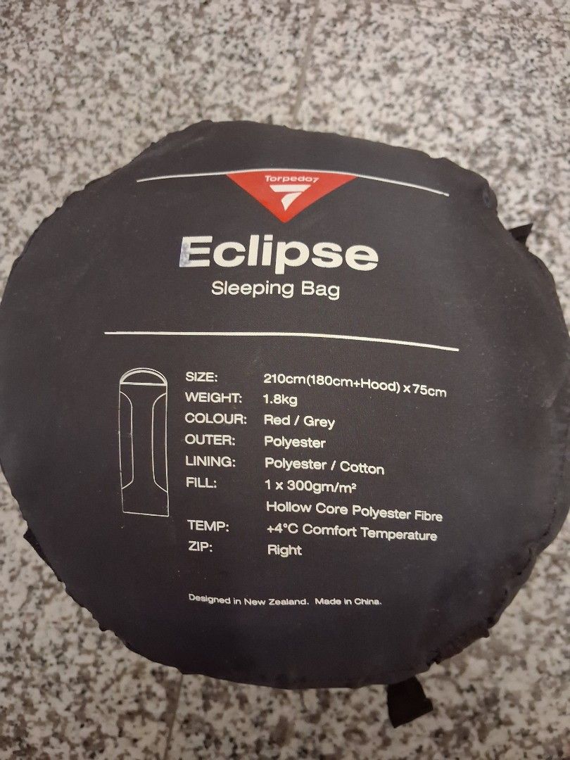 Torpedo7 Eclipse Sleeping Bag Red Grey (Category: Hiking & Camping) located in Tanjung Tokong. Submitted by lalisa.pg (Listing ID 1469011082, Image 1). Description: - Brand: Torpedo7 Eclipse - Colour: Red and Grey - Dimensions: 210cm x 75cm (includes hood) - Weight: 1.8kg - Materials: Polyester outer, cotton lining, hollow core polyester fibre fill - Temperature Rating: Comfort +4°C - Zip Side: Right-hand zip - Portability: Includes compression s