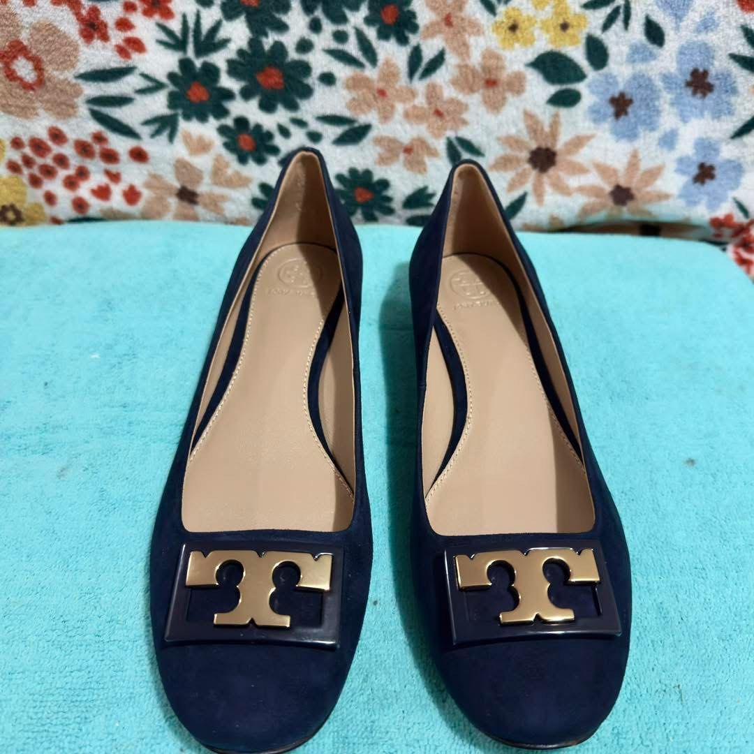 Tory Burch Navy Suede Block Heel Pumps (Category: Heels) located in Batangas. Submitted by lovejiana27 (Listing ID 1469147949, Image 2). Description: - Brand: Tory Burch - Color: Navy blue - Material: Suede - Heel: Low block heel - Details: Gold hardware logo plaque on toe - Condition: Brand new, unworn with clean, scuff-free soles - Ideal for: Work, office wear, or dressing up.