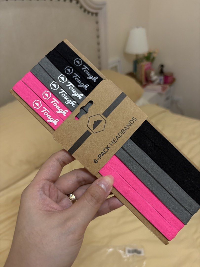 Tough 6-Pack Athletic Headbands Black Grey Pink (Category: Hair Accessories) located in Manila. Submitted by prelovedbymrsd (Listing ID 1469018169, Image 1). Description: - Brand: Tough - Quantity: 6 headbands per pack - Colors: Black, grey, and hot pink - Features: Stretchable fabric with printed logo and mountain icon - Condition: Brand new, unused LOC: BF Homes Parañaque.