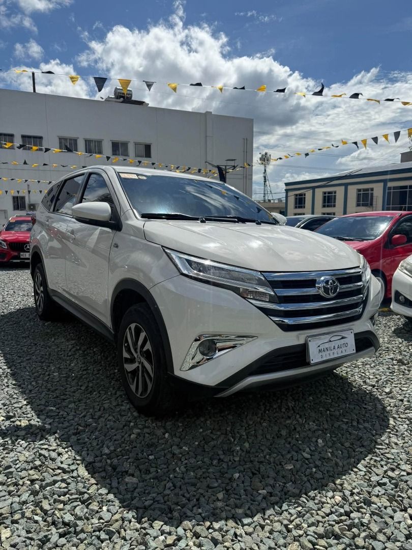 Toyota Rush E 1.5L Auto (Category: Used Cars) located in Pasig City. Submitted by pureocean-057512 (Listing ID 1468973349, Image 2). Description: 2018 TOYOTA RUSH E 1.5L GAS AUTOMATIC TRANSMISSION Downpayment: ₱142,848 White 61tkms mileage Automatic Transmission 5 ending plate Gasoline Engine 5 seater Fabric upholstery Automatic Climate Control with Rear Vents Touchscreen audio system Bluetooth connectivity & USB / AUX Adjustable Driver Seat & Co