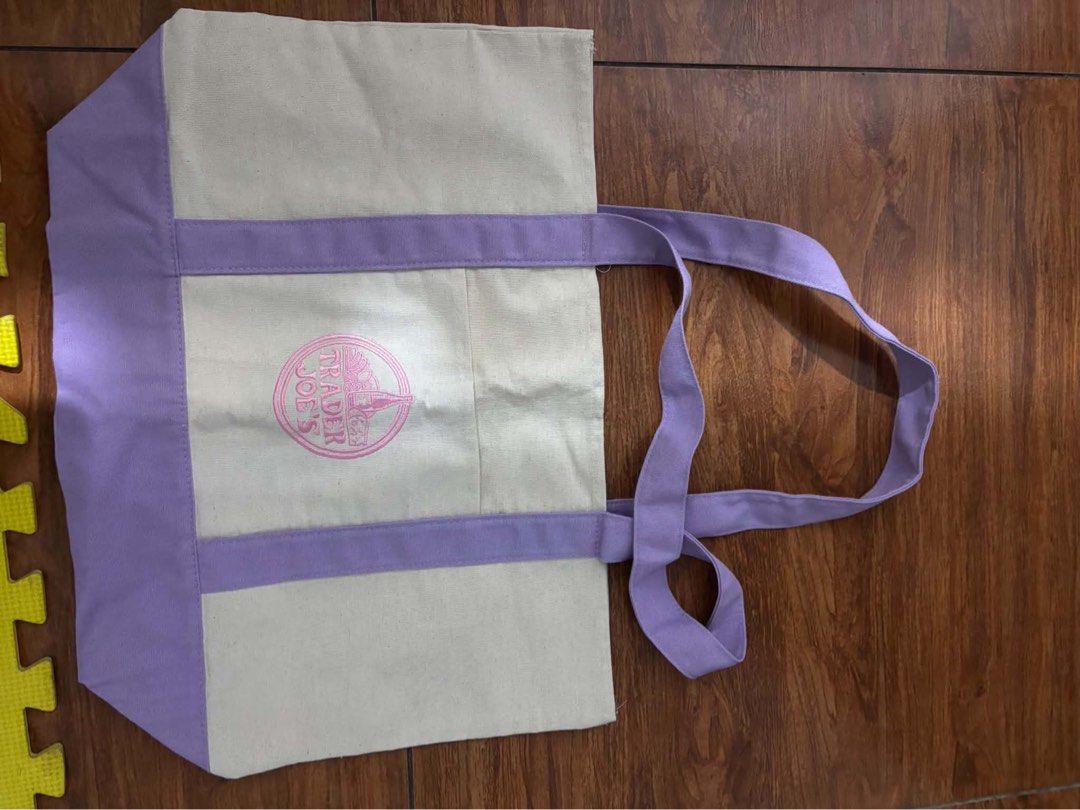 Trader Joe's Mini Canvas Tote Bag (Category: Tote Bags) located in Marilao. Submitted by pinhail (Listing ID 1469060316, Image 2). Description: s: 620 l: 799 - Authentic Trader Joe's mini canvas tote bags - Available colors: Striped green, plain purple, striped pink, and striped beige - Features: Small handles and a convenient front pocket with embroidered logo - Condition: Brand new with original paper tags attached on two of them - Perfect size