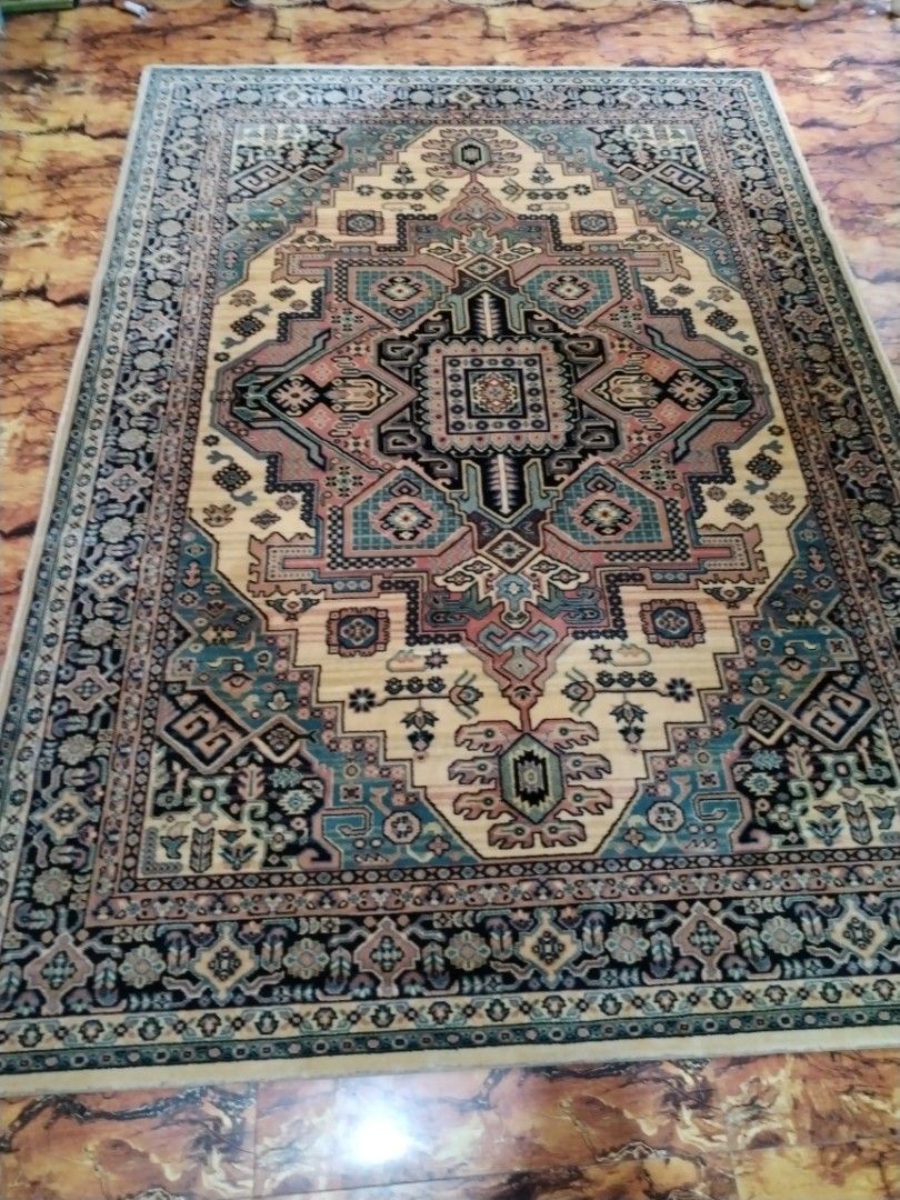 Traditional Persian Style Area Rug Geometric Pattern (Category: Carpets, Mats & Flooring) located in Caloocan City. Submitted by rowely_jpn (Listing ID 1469100282, Image 1). Description: Japan surplus Large area rug with traditional Persian style geometric patterns. Cream center surrounded by intricate borders in shades of blue, black, and pink. Thick woven pile with finished edges. Clean overall surface with minor wear near the backing edge poin