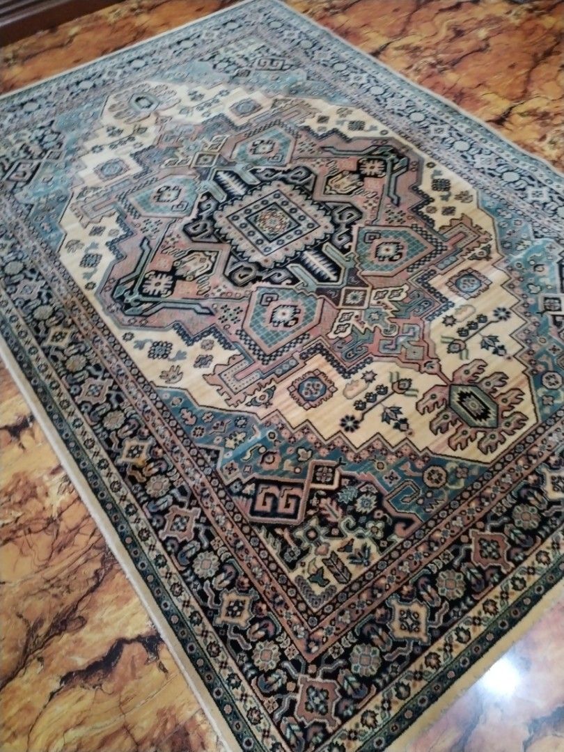 Traditional Persian Style Area Rug Geometric Pattern (Category: Carpets, Mats & Flooring) located in Caloocan City. Submitted by rowely_jpn (Listing ID 1469100282, Image 2). Description: Japan surplus Large area rug with traditional Persian style geometric patterns. Cream center surrounded by intricate borders in shades of blue, black, and pink. Thick woven pile with finished edges. Clean overall surface with minor wear near the backing edge poin