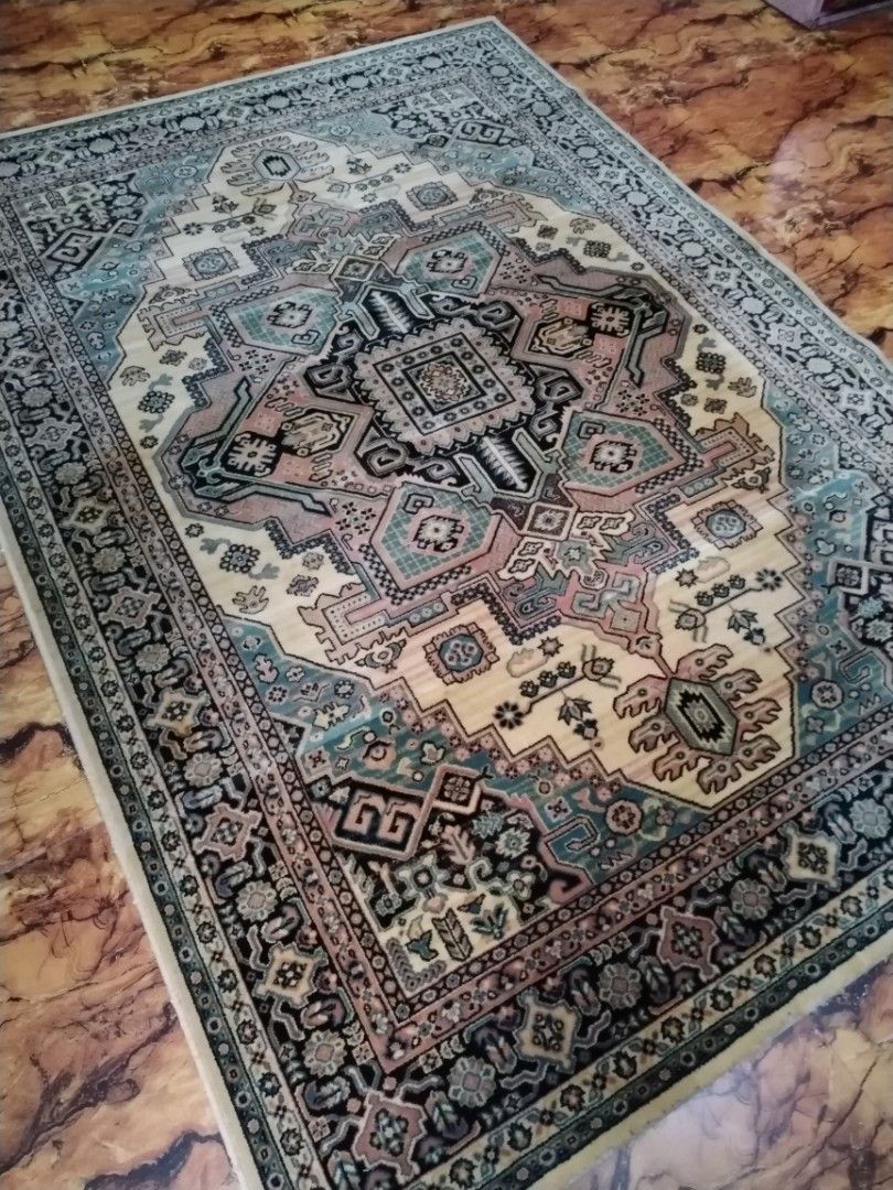 Traditional Persian Style Area Rug Geometric Pattern (Category: Carpets, Mats & Flooring) located in Caloocan City. Submitted by rowely_jpn (Listing ID 1469100282, Image 3). Description: Japan surplus Large area rug with traditional Persian style geometric patterns. Cream center surrounded by intricate borders in shades of blue, black, and pink. Thick woven pile with finished edges. Clean overall surface with minor wear near the backing edge poin