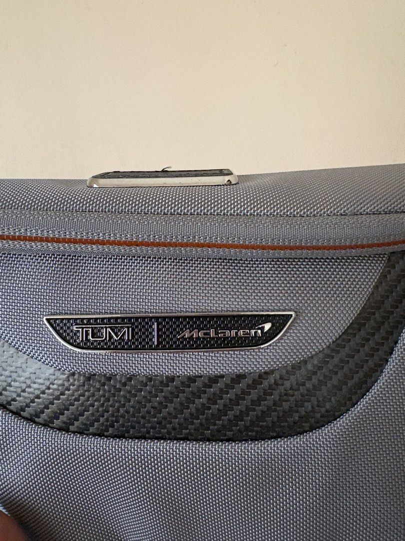 TUMI / Mclaren accessory kit (Category: Luxury Bags & Wallets) located in Manila. Submitted by kats_b (Listing ID 1468932535, Image 2). Description: - Authentic Coach clutch - Colorblock design: red, tan, and navy blue - Gold zipper - Small wrist strap - Tan interior with small pocket - Coach logo detail - Includes Coach tag with chain.