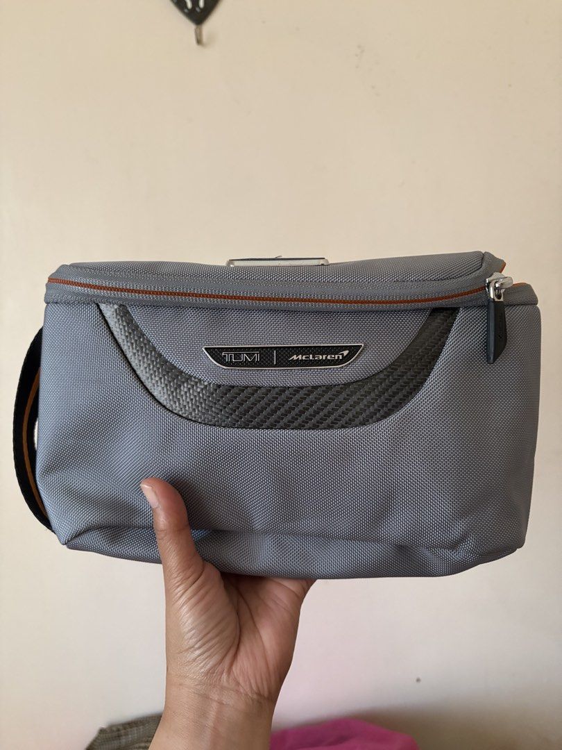 TUMI / Mclaren accessory kit (Category: Luxury Bags & Wallets) located in Manila. Submitted by kats_b (Listing ID 1468932535, Image 1). Description: - Authentic Coach clutch - Colorblock design: red, tan, and navy blue - Gold zipper - Small wrist strap - Tan interior with small pocket - Coach logo detail - Includes Coach tag with chain.