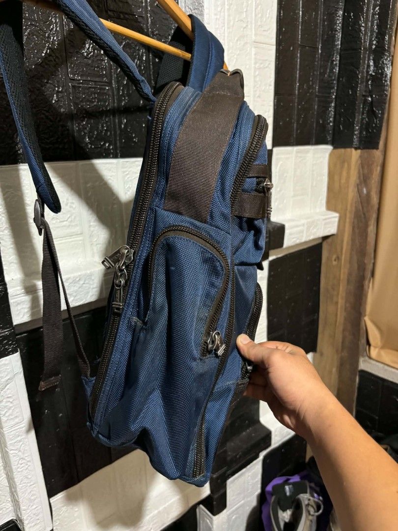 Tumi Blue Backpack With Brown Leather Details (Category: Backpacks) located in Lapu Lapu. Submitted by margaux099 (Listing ID 1468963105, Image 3). Description: - Authentic Tumi backpack in blue with stylish brown leather accents - Branded metal zippers and durable fabric construction built to last - Multiple front zippered compartments for easy organization - Padded mesh back panel and shoulder straps for maximum comfort - Built-in leather lugga