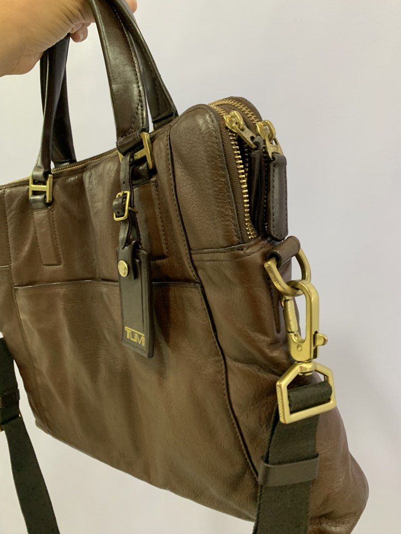TUMI briefcase Laptop bag (Category: Luxury Bags & Wallets) located in Bacolod City. Submitted by garagehunterbuyandsale (Listing ID 1468954046, Image 3). Description: Tumi Beacon Hill Branch Slim Laptop Briefcase or Beacon Hill Irving Slim Leather Briefcase crafted from full-grain leather with gold-tone hardware • Material: Dark brown full-grain leather • Hardware: Gold-tone metal accents and zippers • Carry Options: Dual top leather grab handle