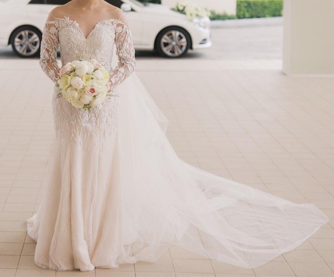 Two-Way Wedding Gown (Category: Evening dresses & gowns) located in Cebu City. Submitted by mikranza (Listing ID 1468946201, Image 1). Description: FOR SALE: Two-Way Wedding Gown | ₱38,000 negotiable Embellished wedding gown, worn once and professionally dry cleaned. Shown in two looks: with lace sleeves for the ceremony and strapless for the reception. Matching sleeves and veil included. The sleeves can be sewn back on if preferred. Fits small t