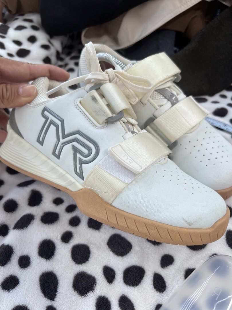 TYR L-1 Lifter Weightlifting Shoes (Category: Sneakers) located in Rizal. Submitted by imallari88 (Listing ID 1469017975, Image 2). Description: TYR L-1 Lifter shoes in white with gum soles. Men size 4.5, women size 6, EU 36.5 ( Pero sakto sa size 5.5 ) Double strap lockdown system across the top. Red insoles read Always In Front. Light scuff marks on the front toe box and some wear visible near the straps from training sessions. Still plenty of 