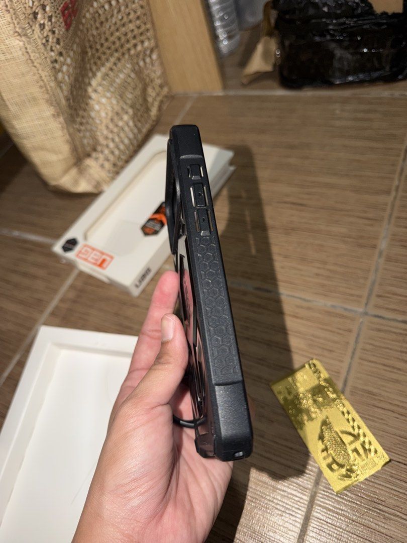 UAG Monarch Pro 17 Promax (Category: Cases & Sleeves) located in Taguig. Submitted by zelpremo (Listing ID 1469085823, Image 3). Description: - Brand/Model: UAG Monarch Pro - Compatibility: iPhone 17 Pro Max - Color: Black with carbon fiber accents - Condition: Excellent, lightly used with original box included - Features: Heavy-duty rugged drop protection, precise cutouts, tactile buttons, and built-in lanyard anchor - Fulfillment: Available for