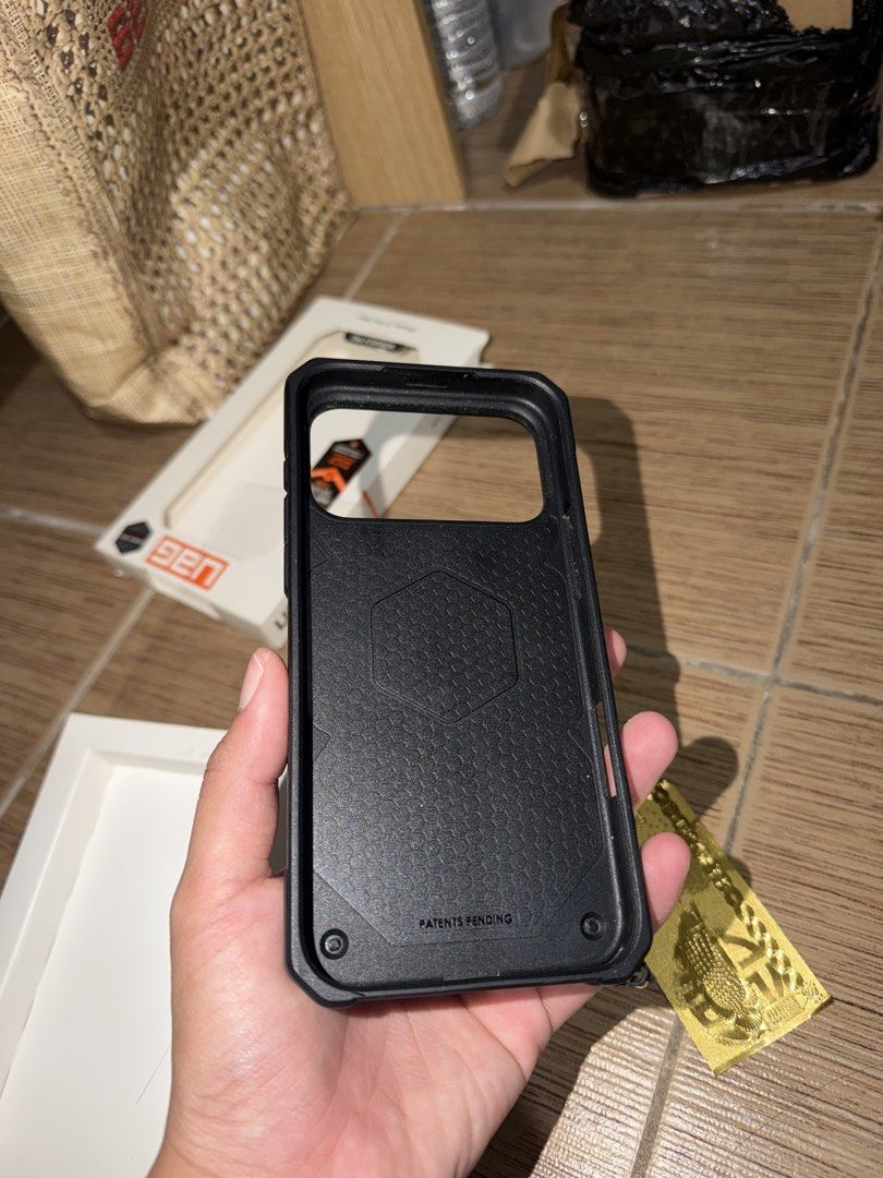 UAG Monarch Pro 17 Promax (Category: Cases & Sleeves) located in Taguig. Submitted by zelpremo (Listing ID 1469085823, Image 2). Description: - Brand/Model: UAG Monarch Pro - Compatibility: iPhone 17 Pro Max - Color: Black with carbon fiber accents - Condition: Excellent, lightly used with original box included - Features: Heavy-duty rugged drop protection, precise cutouts, tactile buttons, and built-in lanyard anchor - Fulfillment: Available for