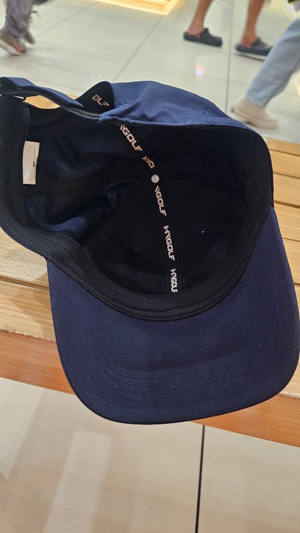 Under Armour Golf Cap Navy Blue (Category: Caps & Hats) located in Manila. Submitted by redbullhonda (Listing ID 1468955615, Image 3). Description: - Brand: Under Armour - Color: Navy blue with bright blue embroidered logo - Details: UA Golf embroidery on side, branded interior seam taping - Closure: Adjustable back strap - Condition: Clean fabric and stitching throughout.
