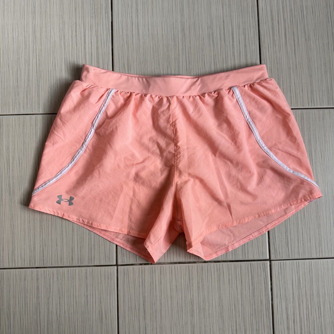 Underarmour running shorts (Category: Activewear) located in Makati City. Submitted by ellespreloved2.0 (Listing ID 1469051059, Image 1). Description: In very good condition No flaw Fits 27-30 With built in undies Inside pocket and draw strings.