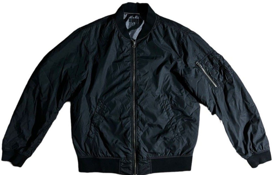 Uniqlo Bomber Jacket (Black) (Category: Coats, Jackets and Outerwear) located in Makati City. Submitted by bastybb (Listing ID 1469054809, Image 1). Description: DECLUTTERING! Selling for 500 only! (negotiable) - Color: Classic black - Size: 26L x 23W - Material: Lightweight fabric with smooth finish and clean hardware - Design: Full zip front with ribbed collar, cuffs, and hem - Pockets: Two angled front pockets and a zippered utility pocket on 