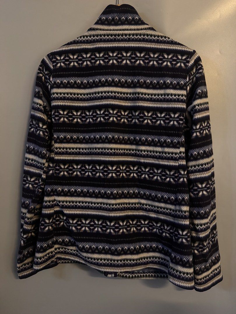 Uniqlo Fair Isle Pattern Fleece Zip-Up Jacket (Category: Coats, Jackets and Outerwear) located in Alaminos. Submitted by outfitcheck.ph (Listing ID 1469103971, Image 2). Description: - Brand: Uniqlo - Style: Zip-up fleece jacket with stand-up collar - Design: Blue and white Nordic Fair Isle pattern - Size: XL - Material: Soft and cozy fleece - Condition: Excellent - Perfect for layering during cold weather.