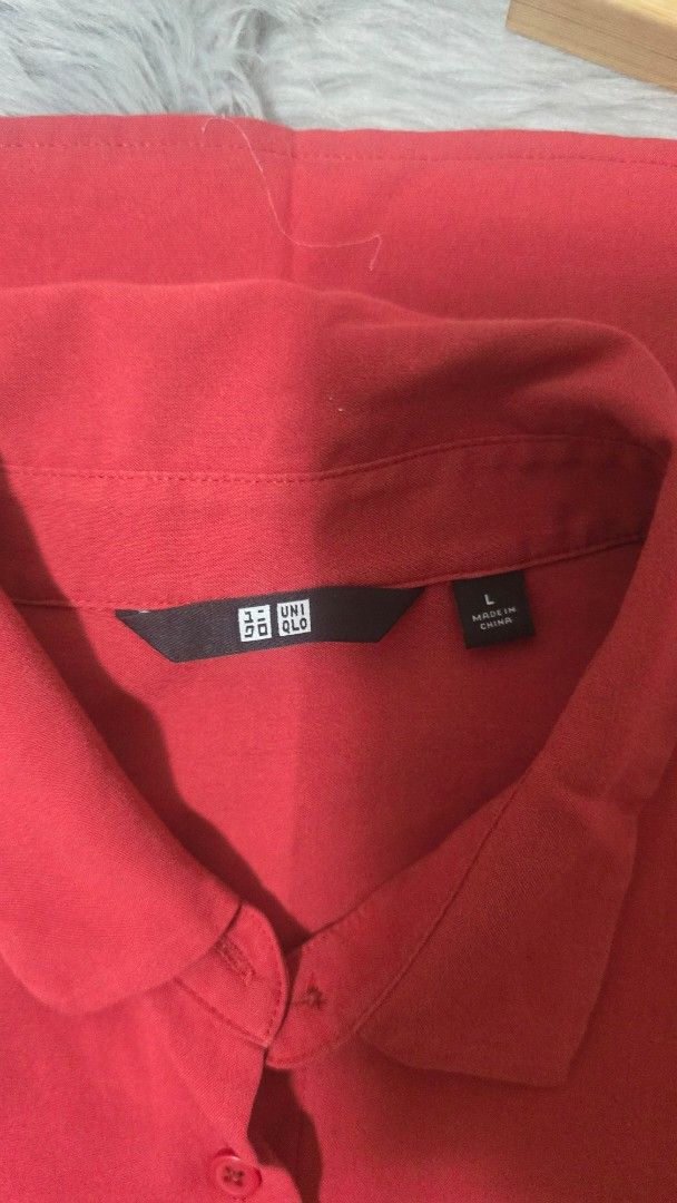 Uniqlo Red Collared Blouse Size L (Category: Blouses) located in Cabanatuan. Submitted by belle_1013 (Listing ID 1469063894, Image 2). Description: - Brand: Uniqlo - Item: Red collared blouse with button-down front - Size: L - Material: Lightweight and smooth fabric - Origin: Made in China.