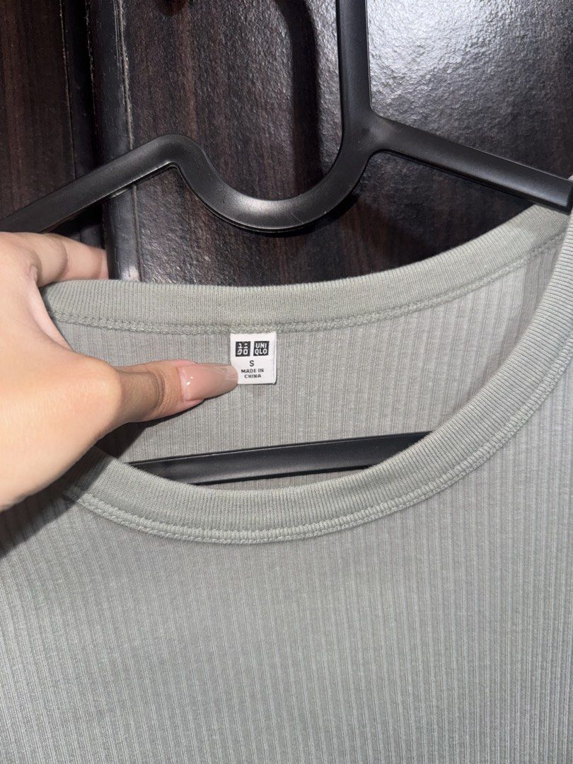 Uniqlo Ribbed Gray Top (Category: Shirts) located in Rizal. Submitted by faven419 (Listing ID 1469097385, Image 2). Description: - Brand: Uniqlo - Color: Sage Green - Size: Small - Material: Comfortable stretchy fabric - Design: Ribbed texture, crew neckline, fitted cut - Condition: Great everyday basic, easy to match with jeans or skirts.