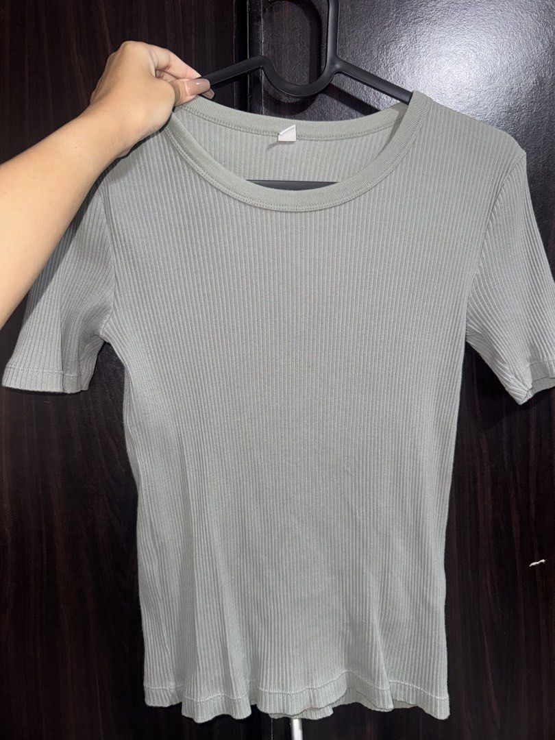 Uniqlo Ribbed Gray Top (Category: Shirts) located in Rizal. Submitted by faven419 (Listing ID 1469097385, Image 1). Description: - Brand: Uniqlo - Color: Sage Green - Size: Small - Material: Comfortable stretchy fabric - Design: Ribbed texture, crew neckline, fitted cut - Condition: Great everyday basic, easy to match with jeans or skirts.