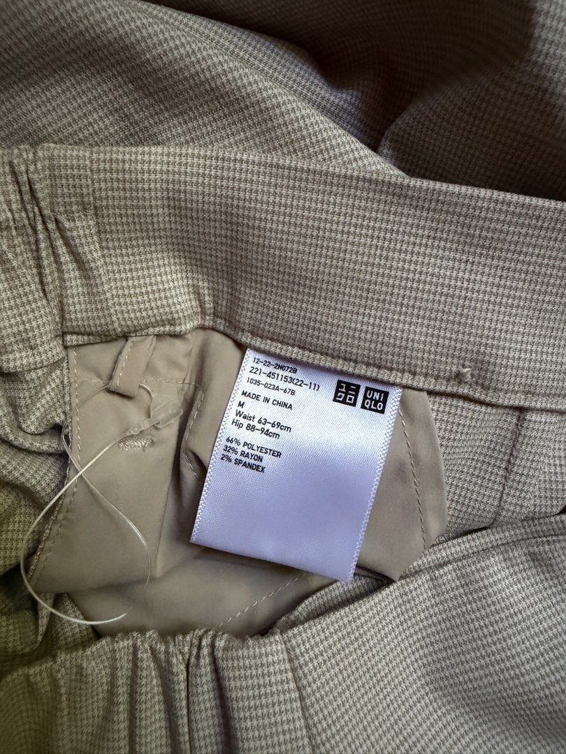 Uniqlo Smart Skort Houndstooth (Category: Skirts) located in Manila. Submitted by lovedbyina_190606 (Listing ID 1469000277, Image 3). Description: * 26-28 waistline * Stretchy polyester-rayon blend fabric. * Machine-washable on a delicate wash cycle. * Chic wrap skort that combines style and functionality. * Asymmetric hemline. * Elastic at the back of the waist for a comfortable fit. * Convenient side pockets. * Classic houndstooth check pattern