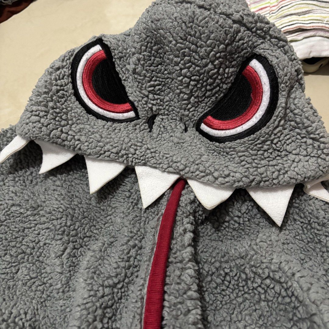 Universal Studios Japan Shark Hooded Blanket (Category: Bedding & Towels) located in Taguig. Submitted by sunnyplaythingsph (Listing ID 1469042488, Image 2). Description: - Authentic Universal Studios Japan merchandise - Grey shark hooded blanket made with ultra-soft, fuzzy fleece - Fun attached hood featuring embroidered red eyes and felt teeth - Stylish red trim lining along the front opening and edges - Brand new with official tags attached - 