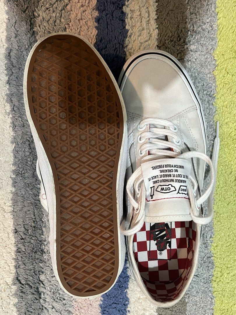 Vans Old Skool DIY White Sneakers (Category: Sneakers) located in Manila. Submitted by thriftpogu77014 (Listing ID 1468970132, Image 2). Description: - Model: Vans DIY Edition - Color: Classic Off-White canvas - Unique Details: 'Punch Here' stitching & subtle red accent stitching - Interior: Eye-catching red checkered lining - Branding: Custom tongue label with laundry-style graphics - Sole: Classic waffle rubber outsole - Inclusions: Comes with 