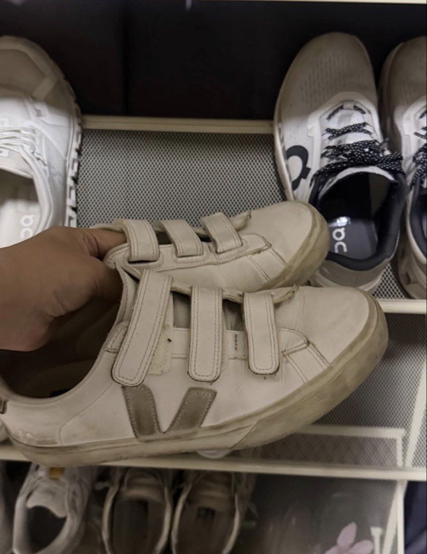 Veja Recife Velcro White Sneakers (Category: Sneakers) located in Manila. Submitted by frankietheresee (Listing ID 1468944476, Image 1). Description: - Brand: Veja - Style: Low-top sneakers with triple hook-and-loop (velcro) straps - Color: White leather with greyish signature V logo - Soles: Durable rubber soles - Condition: Pre-loved with visible wear, scuff marks on the upper, and yellowing on the midsoles - Functionality: All straps secure pr