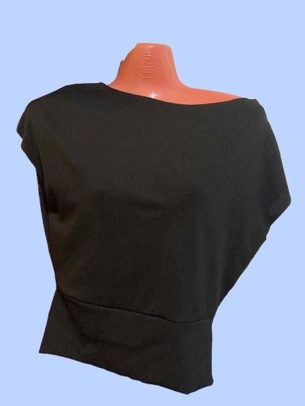 Versatile Convertible Black Ribbed Top Multi-way Neckline (Category: Sleeveless) located in Manila. Submitted by joclutter (Listing ID 1469159726, Image 3). Description: - Color: Black - Material: Stretchy, super comfortable fabric - Versatile Neckline: Wear as cowl neck, off-shoulder, or boat neck - Design: Fitted banded hem keeps the top securely tucked - Style: Great basic piece that is easy to dress up or down.