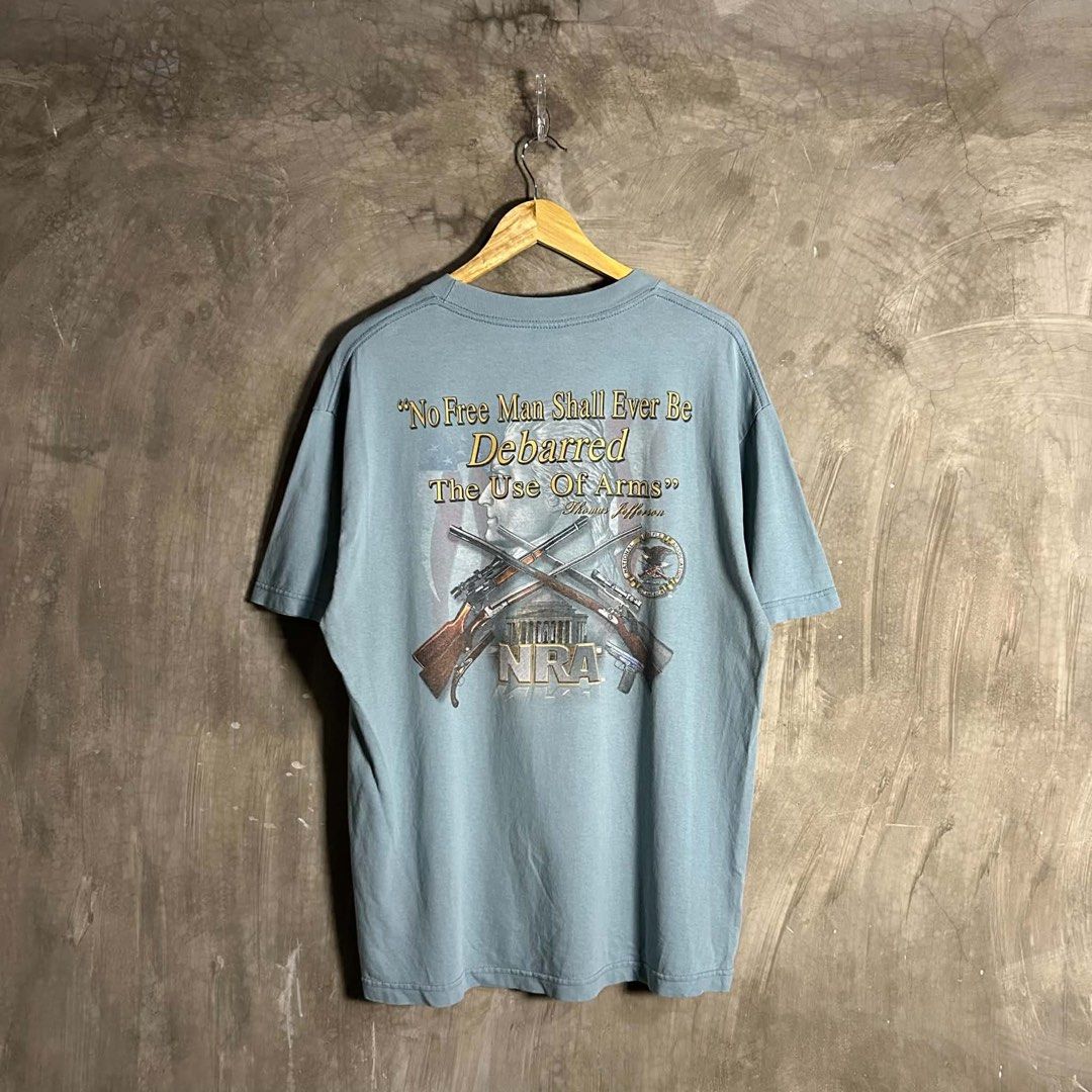 Vintage 2000’s NRA - Mullet Tee (Category: Tshirts & Polo Shirts ) located in Tayabas. Submitted by streetdept.ph (Listing ID 1469111099, Image 1). Description: Vintage 2000’s NRA - Mullet Tee Measurements (inches): Width: 21.5” Length: 29” Tagged as Large 8/10 condition Flaw/s: both armpit has issues & minimal hairlines .
