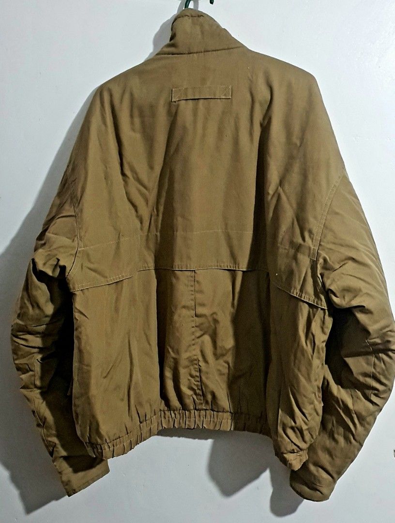 Vintage Brown Bomber Jacket with Green Collar (Category: Coats, Jackets and Outerwear) located in Castillejos. Submitted by hornets0000 (Listing ID 1468974320, Image 3). Description: Unisex Vintage Boxy Tan Windbreaker Jacket 1990s Gorpcore PHP 300 📝 Product Description Vintage 90s Khaki/Tan Unisex Utility Windbreaker Jacket Awesome retro 1990s outdoor/sailing jacket in a perfect boxy, oversized fit. Features a clean tan/khaki body with a contra
