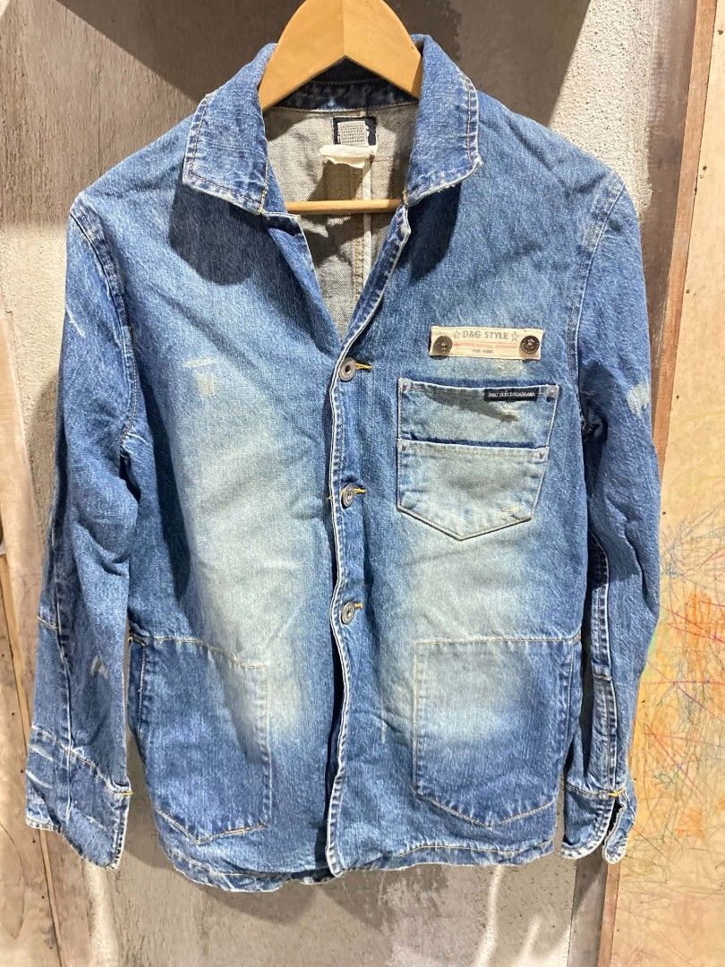 Vintage D&G Dolce & Gabbana Denim Jacket (Category: Coats, Jackets and Outerwear) located in Bontoc. Submitted by tedanzthrift (Listing ID 1468931977, Image 1). Description: -vantage D&G Dolce & Gabbana distressed mud washed denim blazer - Origin: Made in Italy - Style: Vintage denim jacket with classic wash and intentional distressing - Fit: Regular fit - Details: Front button closure, multiple functional pockets - Unique Feature: Iconic leather