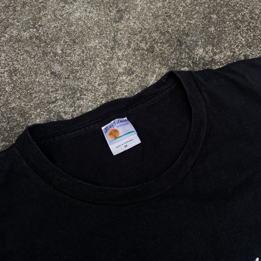 Vintage I'm Not Crazy Graphic Tee 2X (Category: Tshirts & Polo Shirts ) located in Tanza. Submitted by ThriftPieces (Listing ID 1468976085, Image 2). Description: - Brand: Bay Island Sportswear - Color: Black - Size: Tagged 2X (Casual fit) - Material: Cotton with normal wash wear and minor fading - Design: Front graphic text "I'm not crazy I just do bad things when I don't get my meds" - Copyright: Dated 2006 Delinquent Distribution - Origin: Mad