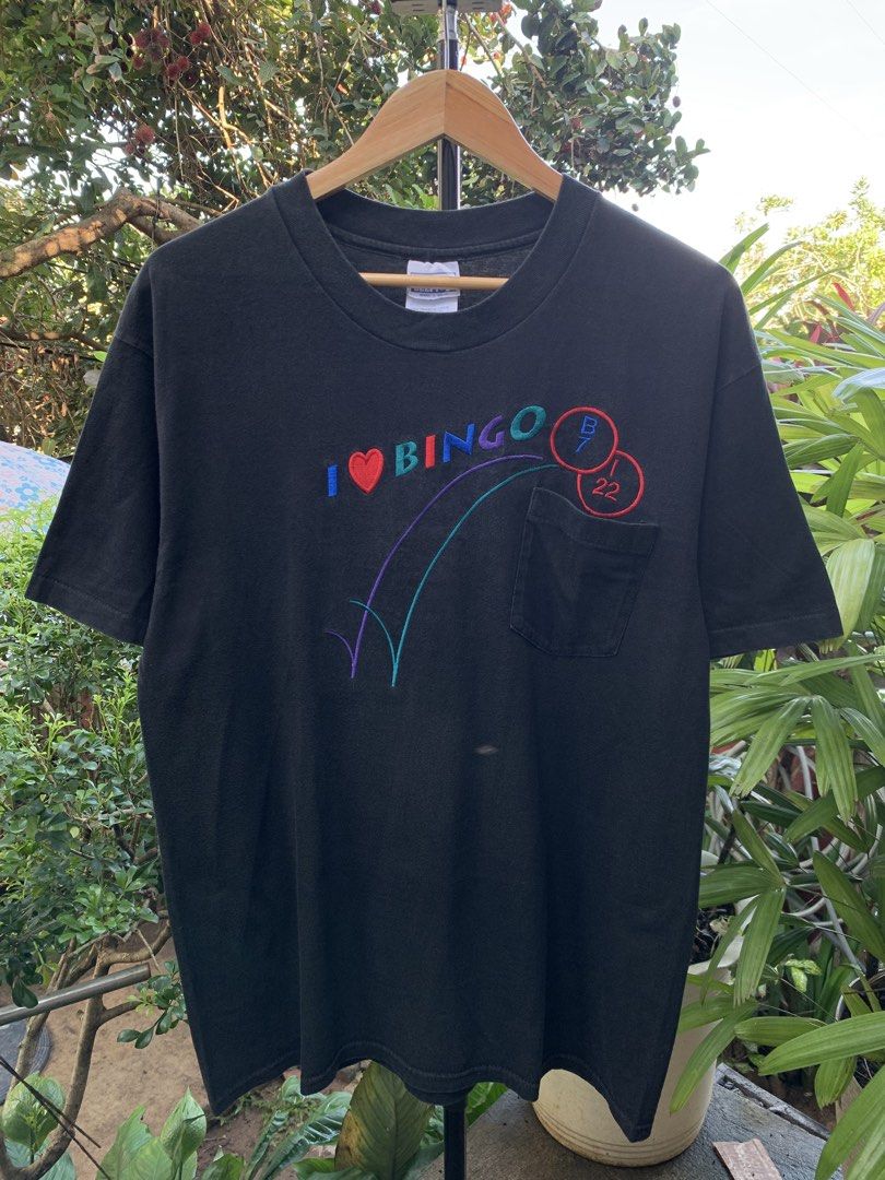 Vintage late 1990s I❤️Bingo statement tee (Category: Tshirts & Polo Shirts ) located in Cagayan de Oro. Submitted by premium_thrifts (Listing ID 1469074068, Image 2). Description: Black colorway. Good condition. Single stitch on sleeves and double on hem Fits Large L29.5" x W21" 20" (shoulder to shoulder) 8.5" (sleeve length) Issue: has fades Add shipping fee (via JRS or J&T).