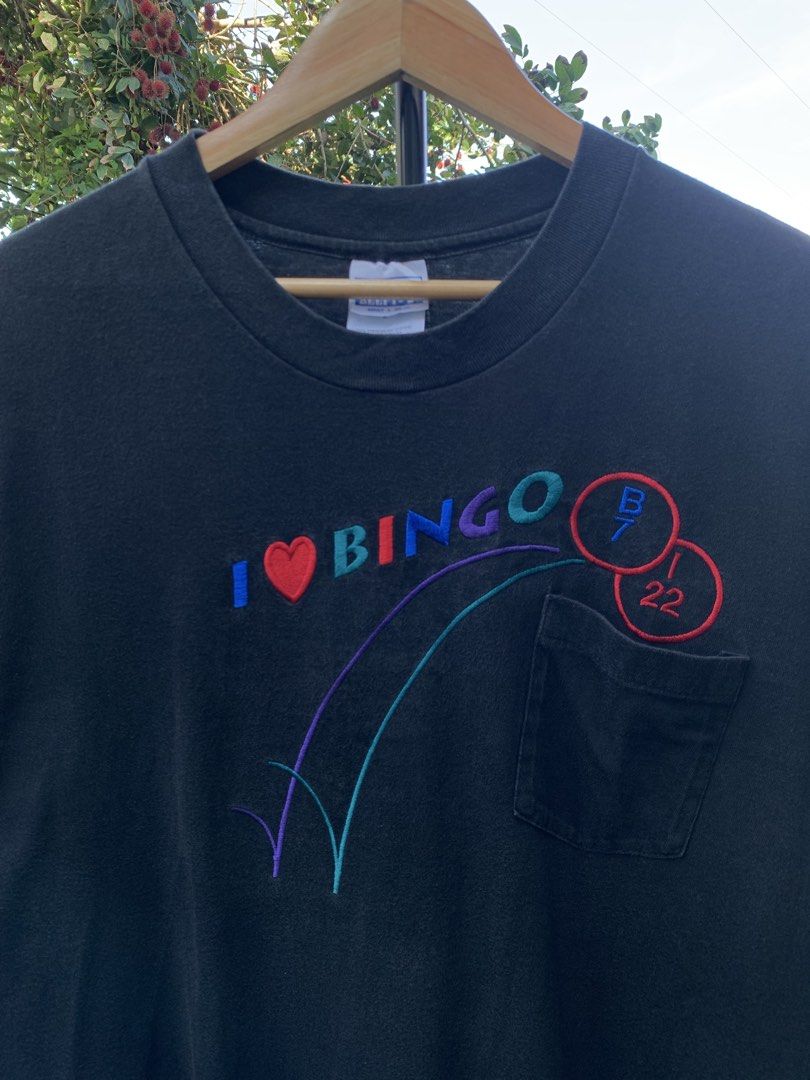 Vintage late 1990s I❤️Bingo statement tee (Category: Tshirts & Polo Shirts ) located in Cagayan de Oro. Submitted by premium_thrifts (Listing ID 1469074068, Image 1). Description: Black colorway. Good condition. Single stitch on sleeves and double on hem Fits Large L29.5" x W21" 20" (shoulder to shoulder) 8.5" (sleeve length) Issue: has fades Add shipping fee (via JRS or J&T).