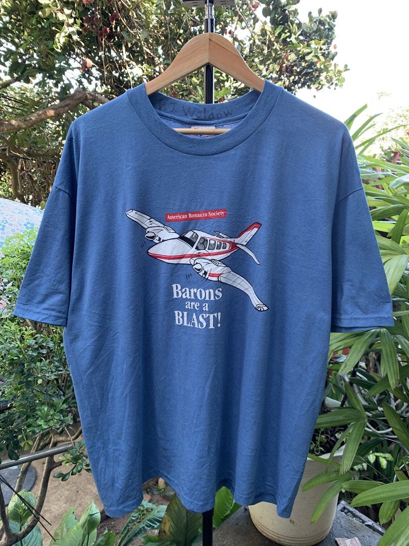 Vintage late 1990s/Y2K Baron plane statement tee (Category: Tshirts & Polo Shirts ) located in Cagayan de Oro. Submitted by premium_thrifts (Listing ID 1469074483, Image 2). Description: Dark cornflower blue colorway. Good condition. Double stitch on both sleeves and hem Fits XL L29" x W23.5" 23" (shoulder to shoulder) 8.8" (sleeve length) Issue: faint spot stains on some parts Add shipping fee (via JRS or J&T).