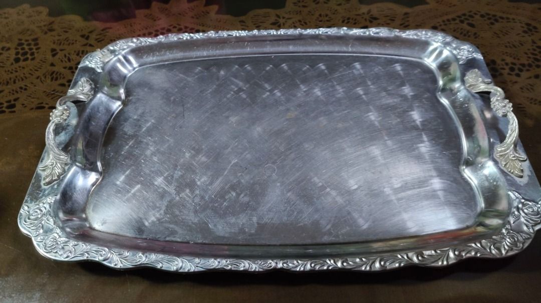 Vintage Silver Plated Rectangular Serving Tray (Category: Dinnerware & Cutlery) located in Quezon City. Submitted by oddduck02 (Listing ID 1468941719, Image 1). Description: - Vintage silver plated rectangular serving tray. - Features a stamped/engraved ornate floral pattern along the raised rim. - Built-in handles with decorative corner motifs on both ends - Shows surface scratches and wear consistent with use. - Approximate Size of tray = L - 4