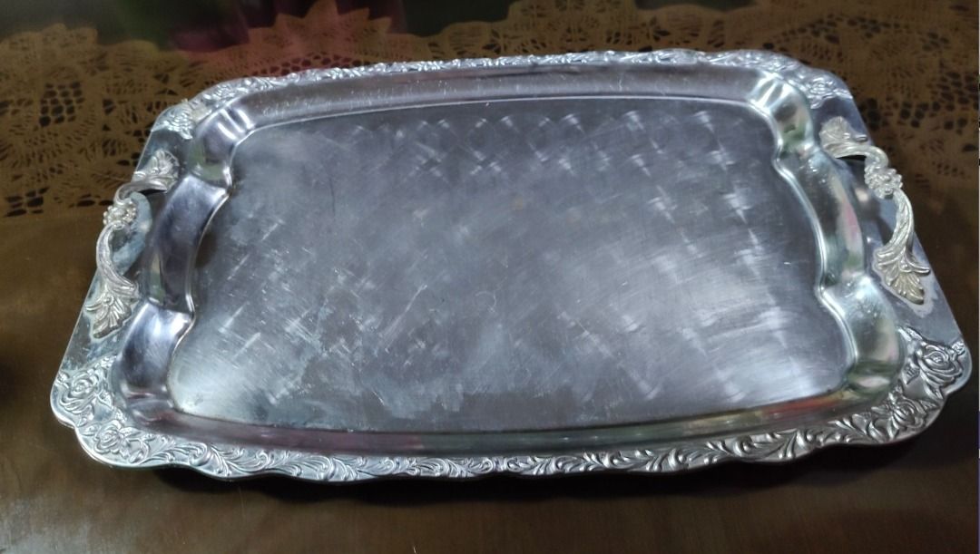 Vintage Silver Plated Rectangular Serving Tray (Category: Dinnerware & Cutlery) located in Quezon City. Submitted by oddduck02 (Listing ID 1468941719, Image 3). Description: - Vintage silver plated rectangular serving tray. - Features a stamped/engraved ornate floral pattern along the raised rim. - Built-in handles with decorative corner motifs on both ends - Shows surface scratches and wear consistent with use. - Approximate Size of tray = L - 4