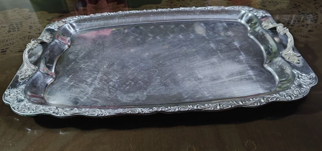Vintage Silver Plated Rectangular Serving Tray (Category: Dinnerware & Cutlery) located in Quezon City. Submitted by oddduck02 (Listing ID 1468941719, Image 2). Description: - Vintage silver plated rectangular serving tray. - Features a stamped/engraved ornate floral pattern along the raised rim. - Built-in handles with decorative corner motifs on both ends - Shows surface scratches and wear consistent with use. - Approximate Size of tray = L - 4