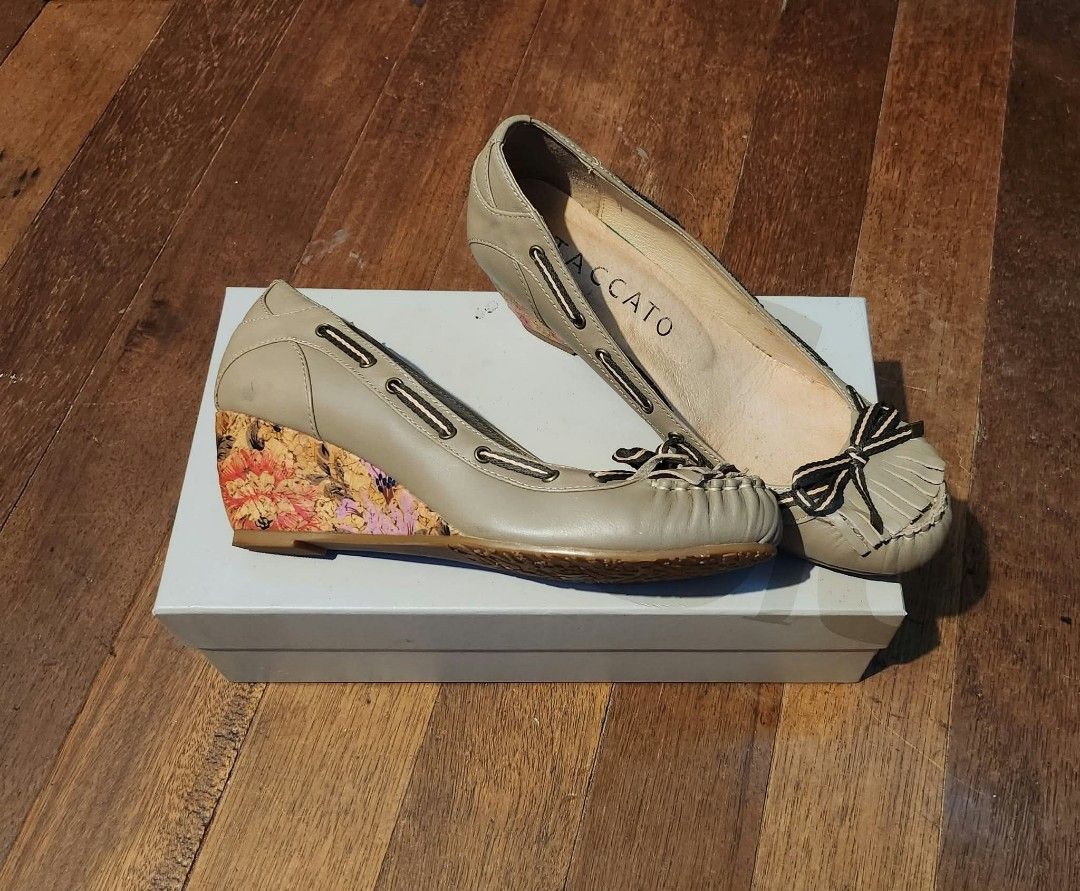 Vintage Staccato Wedge Shoes (Category: Wedges) located in Cebu City. Submitted by vincelouie30387 (Listing ID 1469010983, Image 3). Description: - Brand: Staccato - Type: Vintage Slip-on moccasin wedges - Size: EU 38 - Color: Beige upper with colorful floral print heel - Material: Leather - Features: Fringe and bow detail on the toe, printed wedge heel - Pinterest vibes.